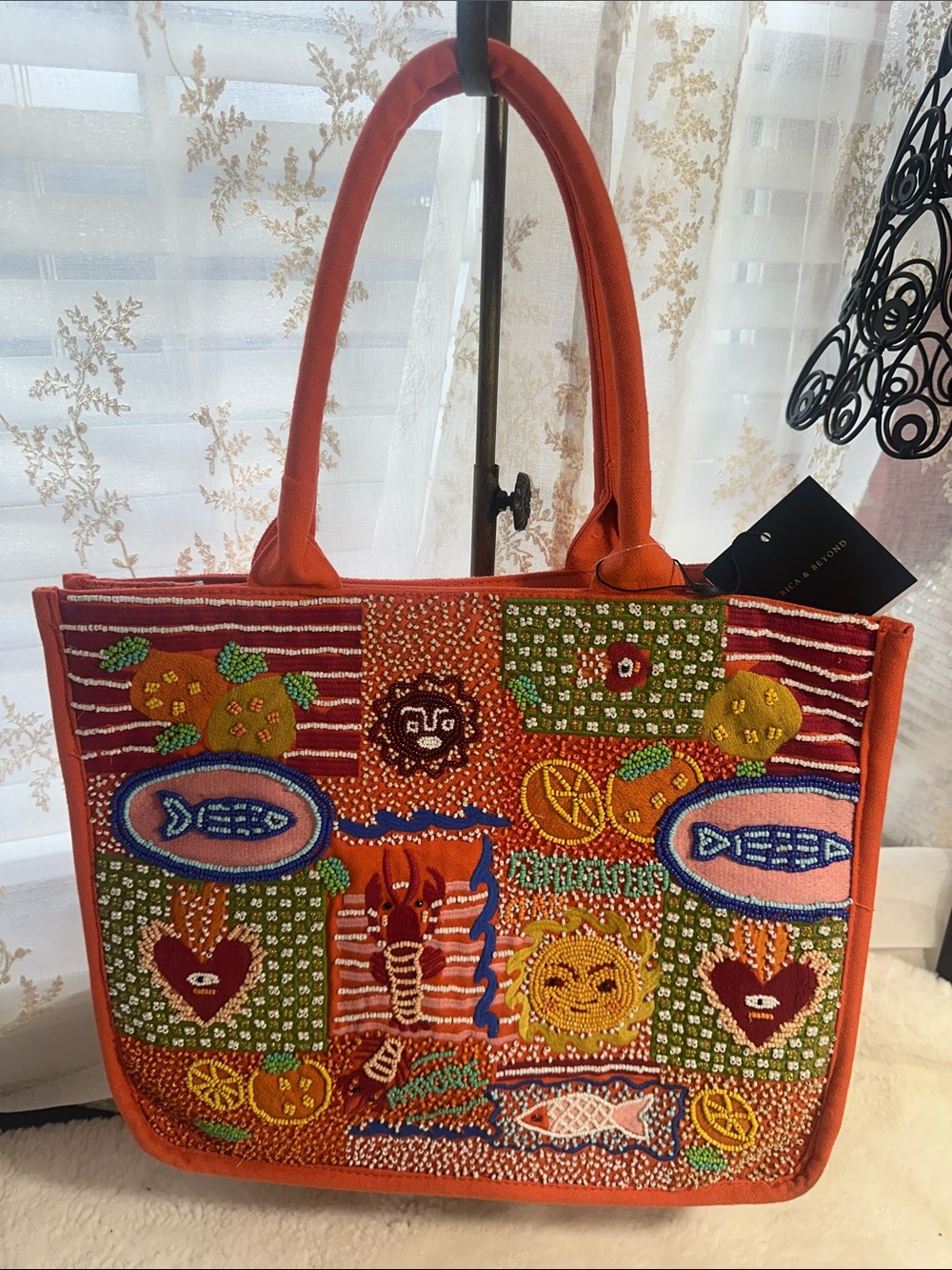 America & Beyond sun and sea beaded orange tote with crossbody strap